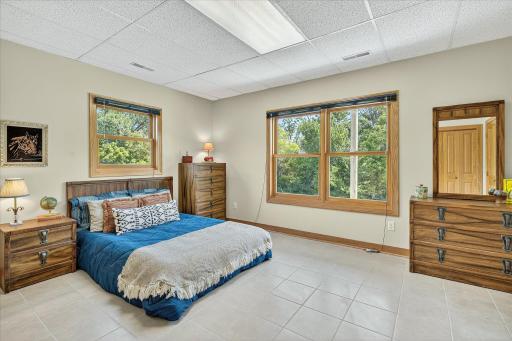 This bedroom is so large, and so are the windows.