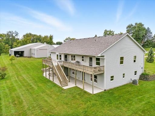 The rear of the house features a full length deck AND a full length concrete patio.