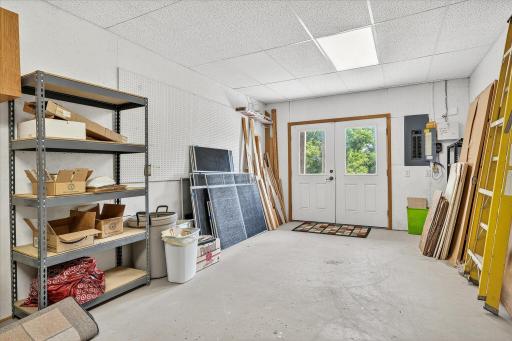 This workshop features heated floors and double doors leading to the back yard, so you can just drive your zero-turn or your ATV right in and out.