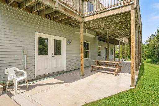 This huge concrete patio extends from one end of the house to the other.