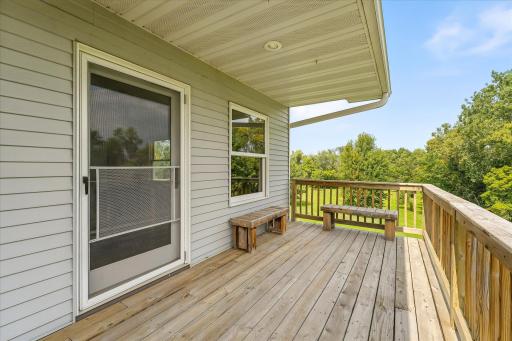 This is the entrance to the primary bedroom. It has a screen door too, so you can sleep with cool, fall fresh air.