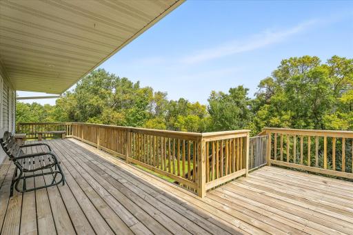 The staircase has a built-in gate. The deck has an entrance to the kitchen AND to the primary bedroom.