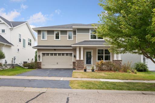 Another look at the front exterior highlights the home’s ideal setting—peaceful, private, and part of the highly desired Millbrook neighborhood.