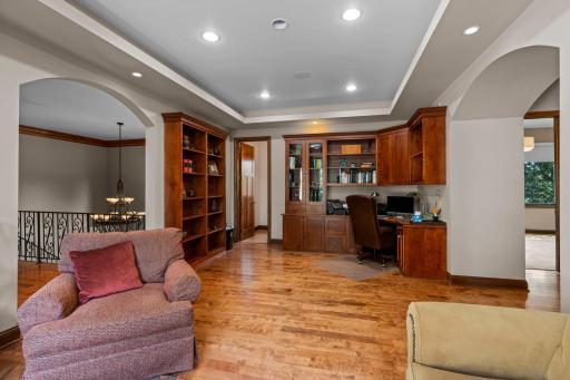 Upper level office includes coved ceiling, numerous built-ins, 1/2 bath, sit-in g room and access to a large balcony overlooking the lake!