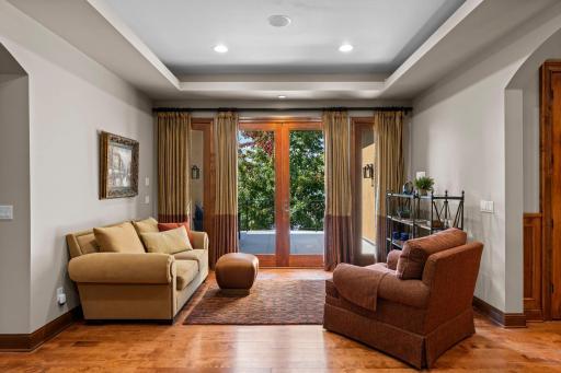 Sitting room just off office, step out to the newly tiled balcony for lake views and incredible sunsets!