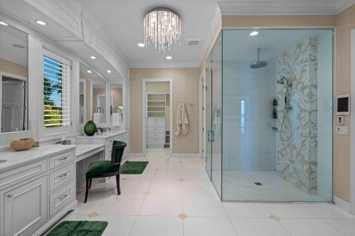 2013 this stunning upper primary suite was added! and expansive vanity with seating, 2nd walk-in closet, steam shower, toilet closet, work out room with lake views, complete privacy!