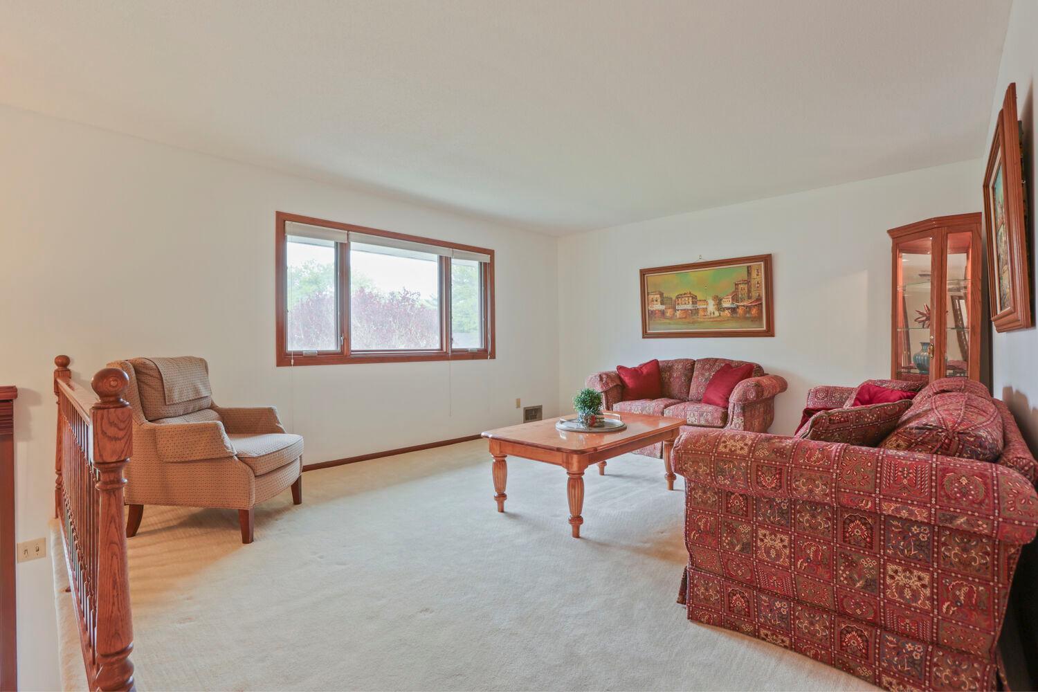 Large living room with an oversized picture window.