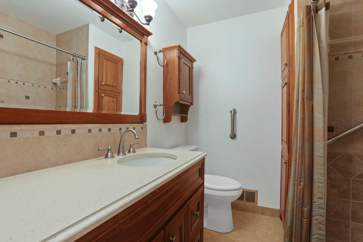 The main bathroom features a walk-in shower.