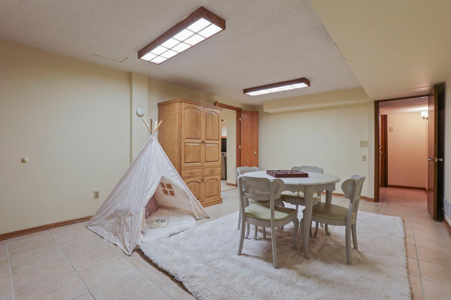 The lower level recreation room can be configured with your personal touches.