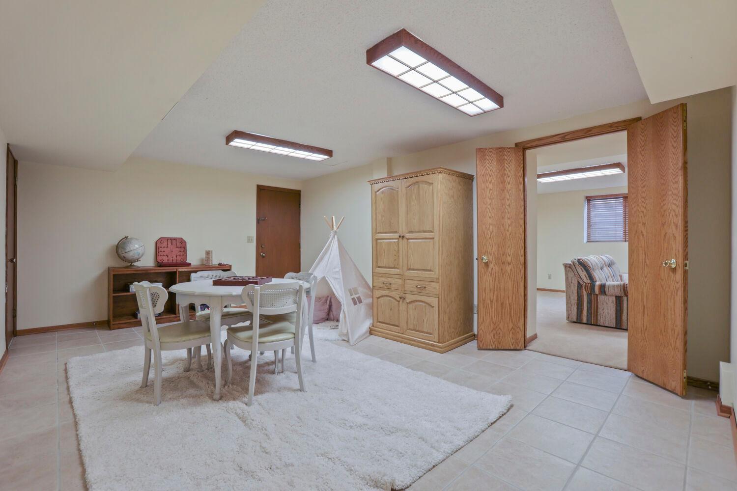 Such a great space for crafting, game playing, playroom, office space, or whatever suits your taste!
