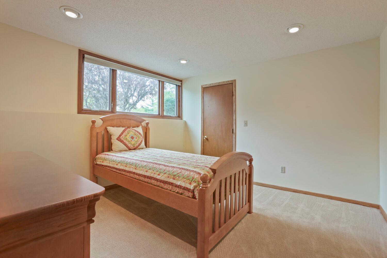 The fourth bedroom on the lower level has a huge window, too! And, it also has two closets!