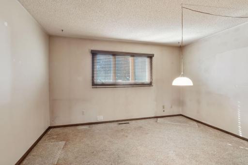 Upper level bedroom had been used as office needs paint and carpet