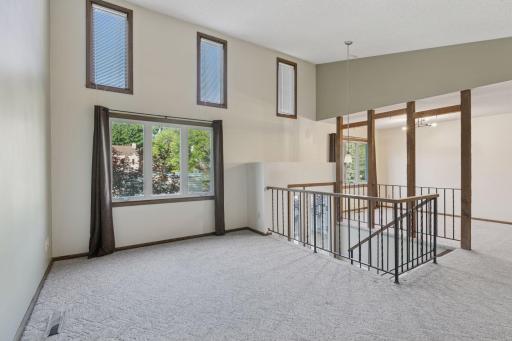 Living room - steps to lower level - nice view out the windows
