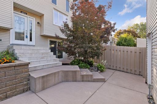 Concrete patio - on the right is the lower level walk out door
