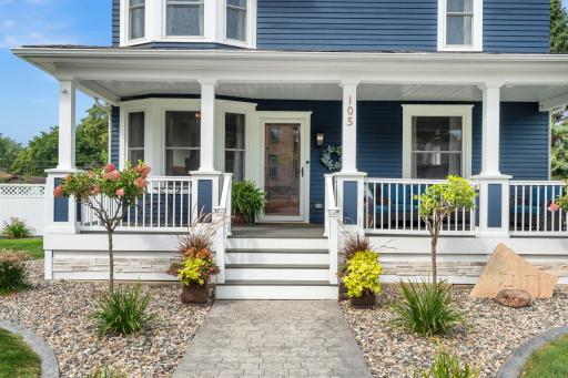 Inviting entry with new sidewalk and concrete curbing around the home