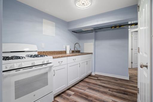 LL Kitchen was added with 3rd oven and additional fridge around the corner.