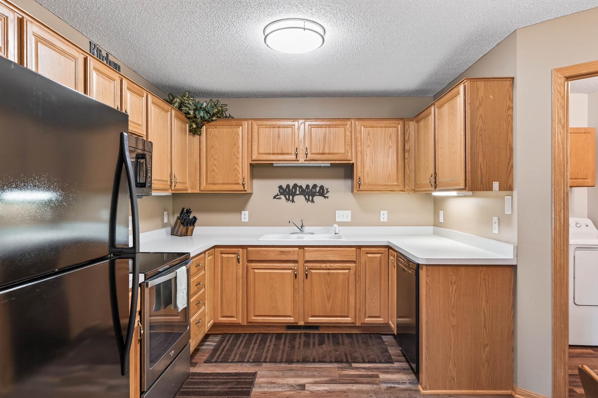 Kitchen leading to Laundry Room & Garage