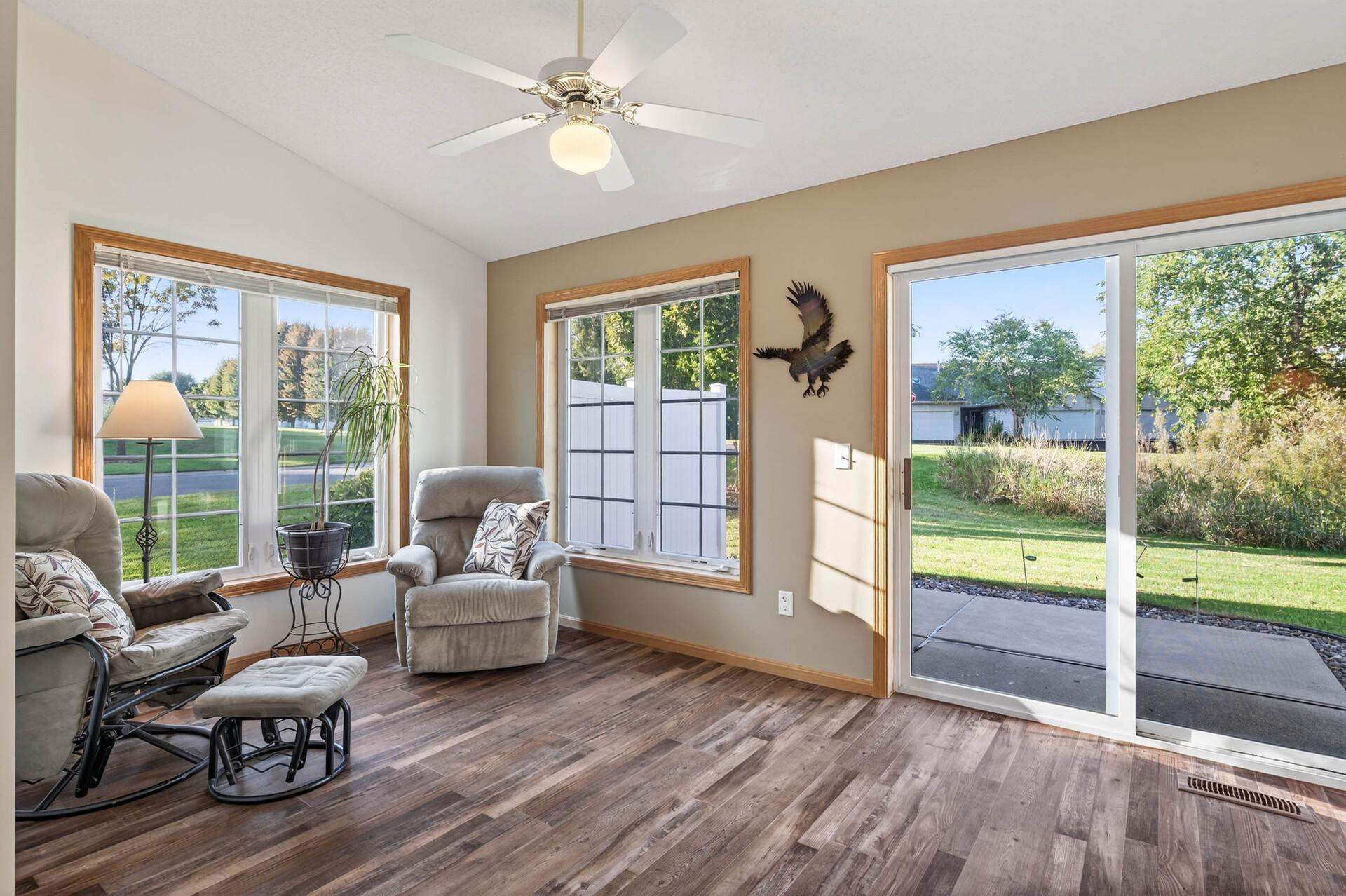 Sun Room leading to Patio with view of wetland and green space