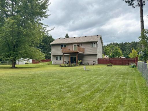 A shot of the home's rear exterior from the backyard.