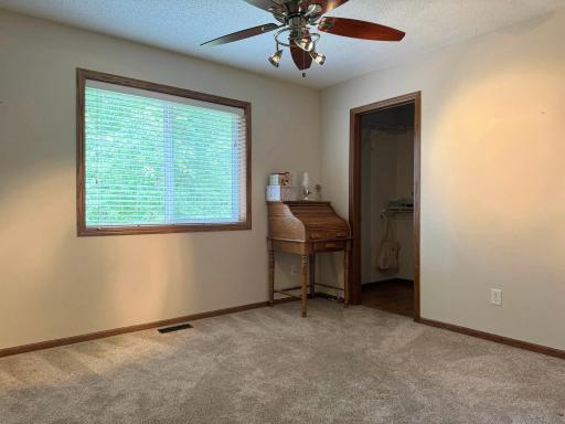 A look into the second bedroom on the upper level.