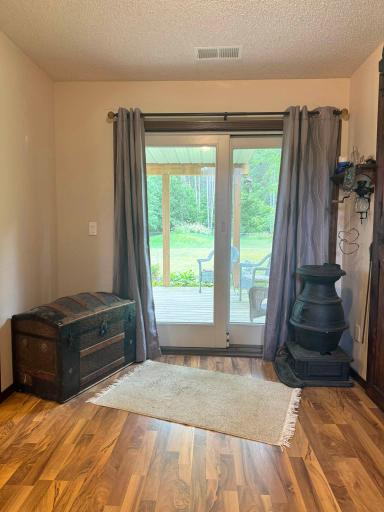 A shot of the lower level foyer featuring the patio door to the backyard.