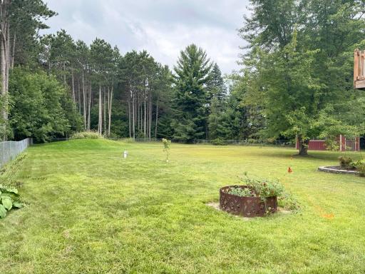 Views of the firepit and beyond in this enormous backyard.