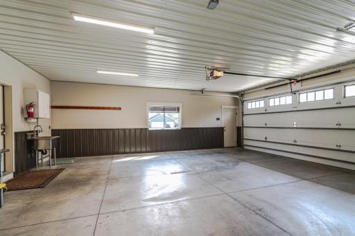 The oversized 3-stall garage is 28' deep at the double door, which is an extra-wide 18' by 8' high. The garage has geo-thermal in-floor heat, floor drain, steel half-walls and ceiling, locking storage, and WIFI openers with battery backup.