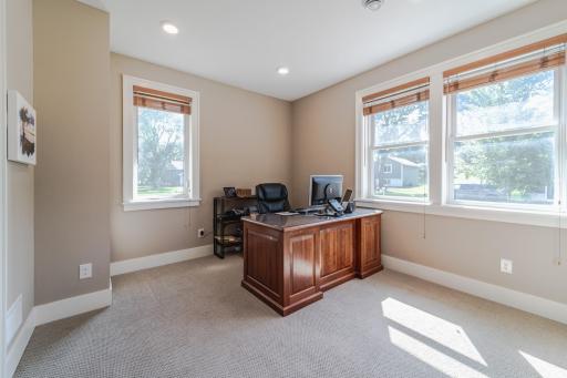 The second main floor bedroom is currently being used as an office and overlooks the front of the home. This room has a walk-in closet and connects to a walk-through FULL bathroom.