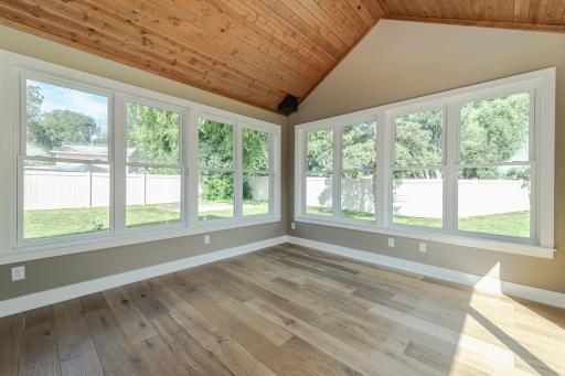 Beautiful wide-plank white oak hardwoods run throughout.