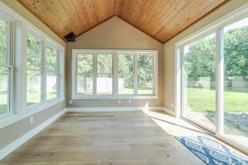 This wood-vaulted space has windows on all 3-sides, with wide-plank white oak hardwood floors with geo-thermal in-floor heat to keep this space cozy in the winter months.