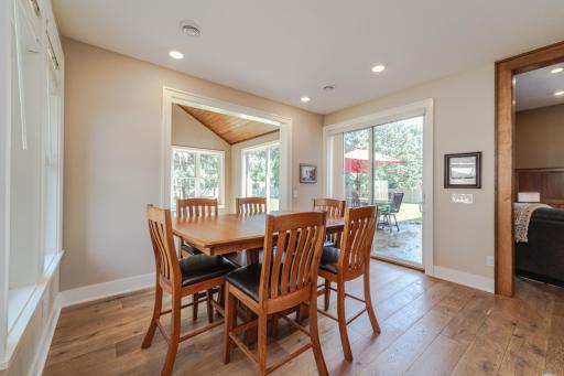 The dining space has a slider door to the patio. Custom trim runs throughout.