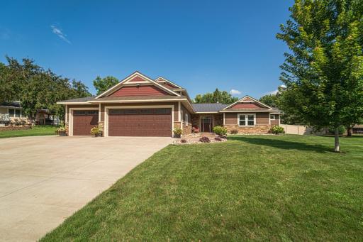 This custom-built home offers ALL PRIMARY LIVING FACILITIES ON THE MAIN FLOOR, as well as guest spaces on the upper level.