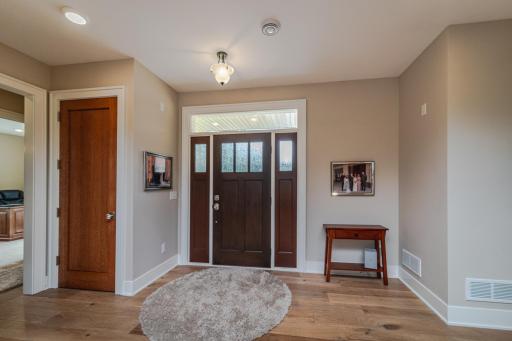 Enter the generous foyer through the front door with its overhead transom. There is a coat closet in the foyer.