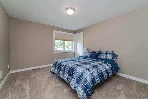 Both upper level bedrooms are spacious and have white trim and walk-in closets.