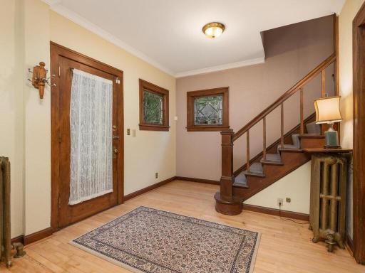 Admire the leaded glass windows & crafstman newel-post