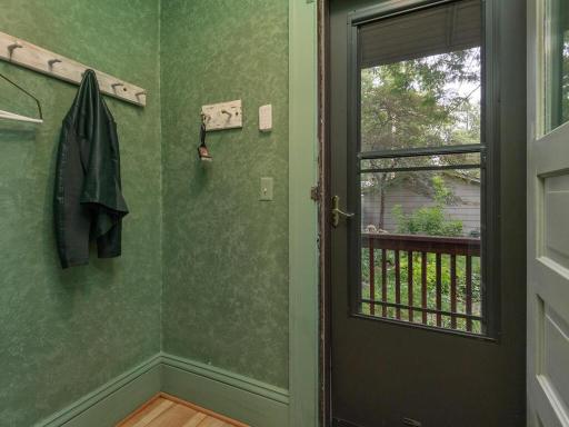 Mudroom off of the kitchen leads to garage sidewalk