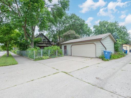 Concrete drive; fenced yard with gates; shade trees - nice!