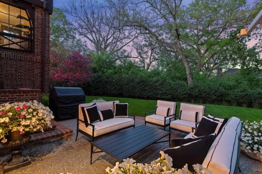 Beautiful days are sure to be spent on this lower level patio observing the green space that surrounds the home.