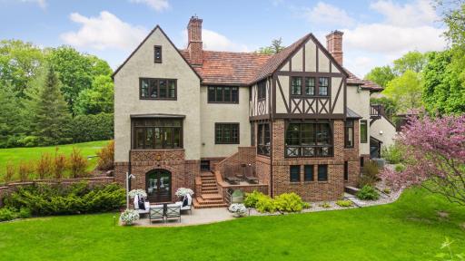 The property features a lovely back patio with private views of the yard.