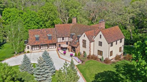 Greenery and mature landscaping surrounds the property.