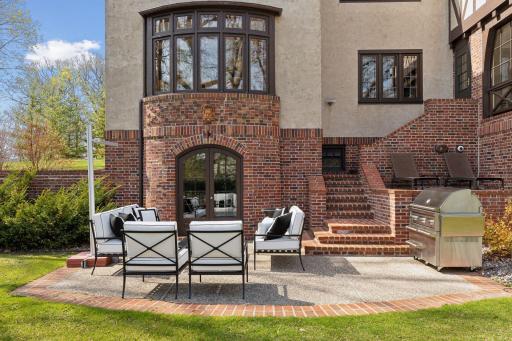 The property features a lovely back patio with private views of the yard.