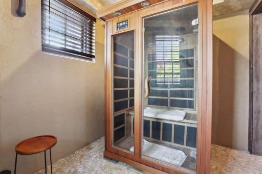 A convenient sauna room in the lower level adjacent to the exercise space.