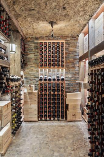The temperature-controlled wine cellar can hold hundreds of your favorite bottles of wine.