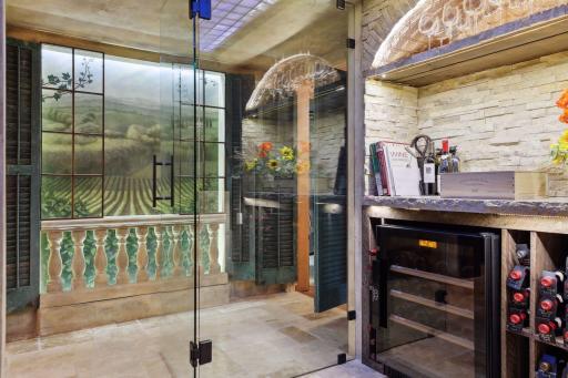 A look from inside the temperature-controlled wine cellar back with a beautifully designed hallway feature.