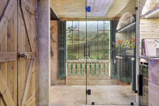 A look from inside the temperature-controlled wine cellar back with a beautifully designed hallway feature.