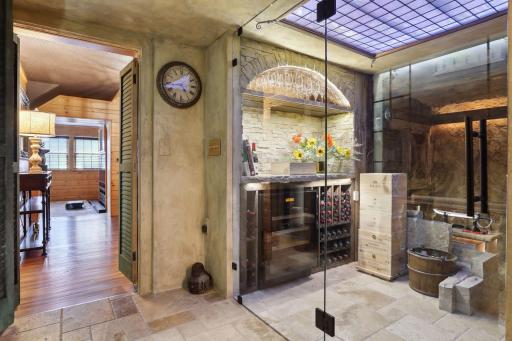The temperature-controlled wine cellar is located on the lower level off.