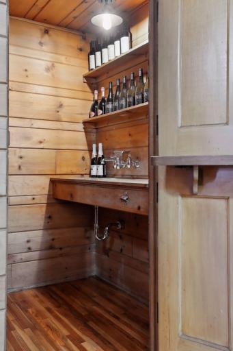 The wet bar with a dutch door making a evening party with guests feel sophisticated.