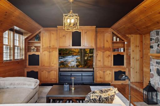 The custom built entertainment system with speakers strategically placed.