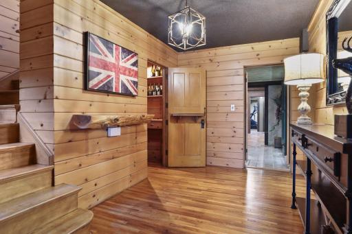 The lower level is finished with an abundance of natural woodwork.