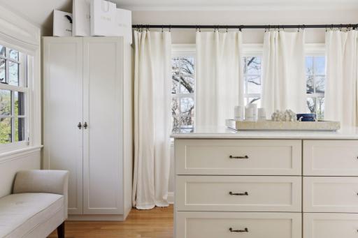 The second bedroom features a large walk-in closet with custom built-ins.
